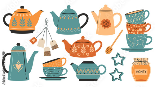 Assortment of cozy kitchen items including decorative teapots, stacked teacups, honey jar, tea bags, and star shaped cookies.