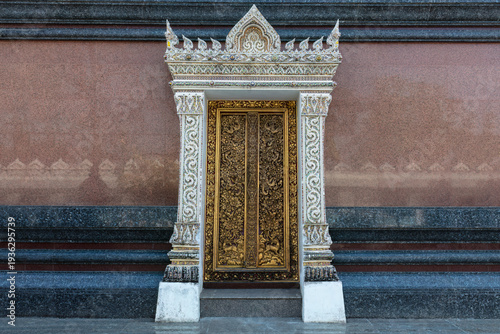 Beautifully decorated doorway adorning one of the buildings of Wat Klang Bang Kaeo, an ancient temple near Bangkok in Nakhon Pathom Provine, Thailand.