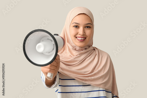 Young Asian Muslim woman wi...
