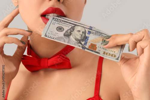 Young prostitute with dolla...