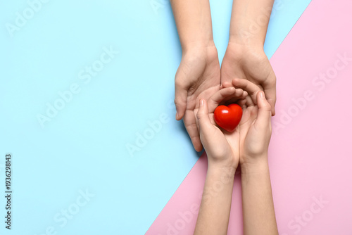 Hands of woman and child wi...