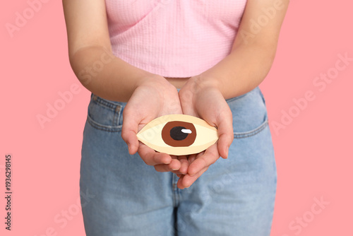 Woman holding paper human e...