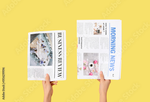 Woman with newspapers on ye...