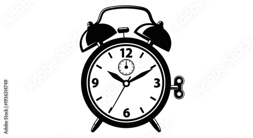 Vintage alarm clock with winding key on white background.