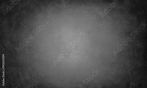 Textured gray background with vignetting subtle grain and soft light distribution