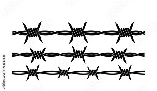 Barbed wire fence with sharp points and twisted metal strands for security or boundary concepts