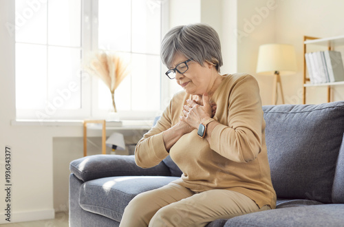 Foto Sick senior woman suffering from chest pain, heart attack, symptoms of cardiovascular diseases