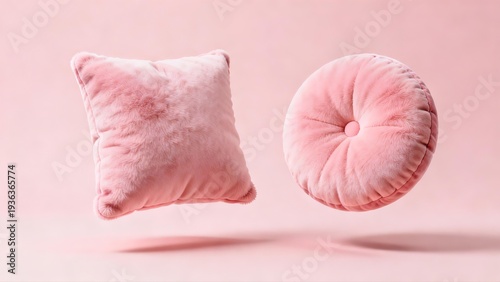Pink fluffy pillows on soft background