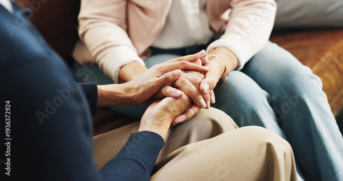 Tableau sur toile Care, friends and holding hands on sofa in home for emotional support, grief and comfort