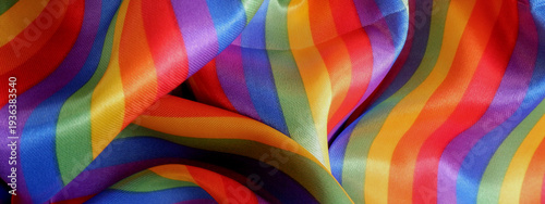 Vibrant abstract rainbow cloth texture. Colorful pride background