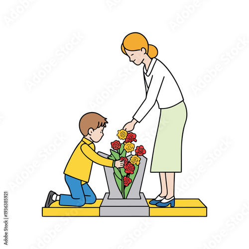Mother and young boy placing flowers at monument for Patriot Day duty