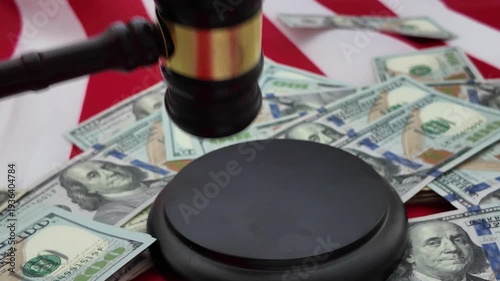 A gavel, once a symbol of authority and lawful order, now lies wrapped in scattered bills and shadowed by the weight of money. The judicial hammer that should strike with fairness and finality instead