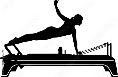 Athlete performing advanced pilates exercise on reformer machine silhouette