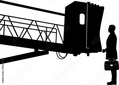 Businessman with briefcase waiting at an airport jet bridge