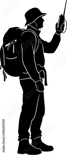 Hiker with backpack using a walkie-talkie for remote communication