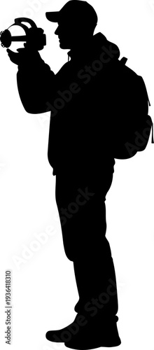 Photographer with backpack recording video outdoors