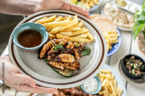 Wallpaper Mural mediterranean style grilled squid with escabeche sauce and fries on white table at ibiza spain restaurant Torontodigital.ca