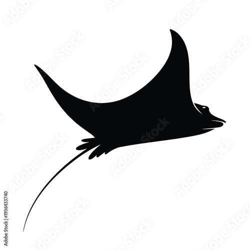 A sleek black silhouette of a manta ray gracefully swimming forward