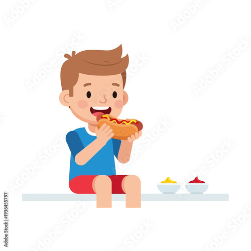 Happy boy eating a hot dog with ketchup and mustard, enjoying a tasty snack.