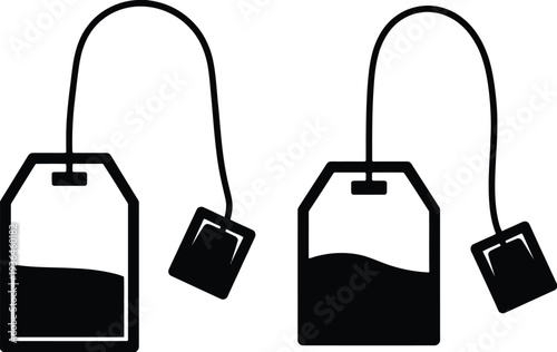 Two black and white tea bags with strings and tags