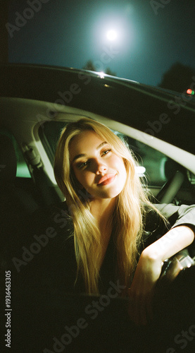 Wallpaper Mural Noir cinematic portrait of blonde woman sitting in car with dramatic lighting and dark background. Gothic mood, luxury lifestyle aesthetic, background Torontodigital.ca
