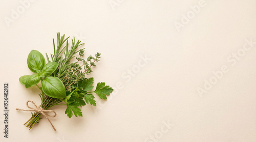 Fresh herbs bouquet on beige background. Green herbs tied with twine, aromatic herbs for easter cooking, clean eating recipes, organic kitchen branding, copy space, spring food theme