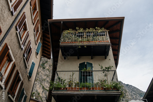 Wallpaper Mural Charming balconies adorned with plants in the picturesque town of Limone sul Garda. Torontodigital.ca