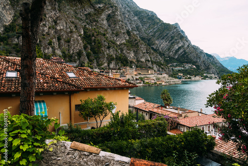 Wallpaper Mural Scenic view of Limone sul Garda with houses, mountains, and the lake. Torontodigital.ca