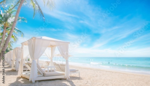 Blurred wallpaper of a summer beach resort featuring cabanas ocean and blue sky