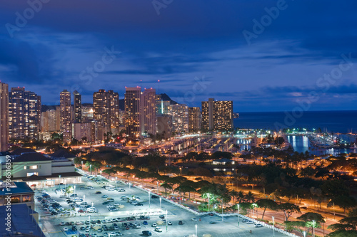 Honolulu, Waikiki, an elevated view of the downtown area and the waterfront at night.