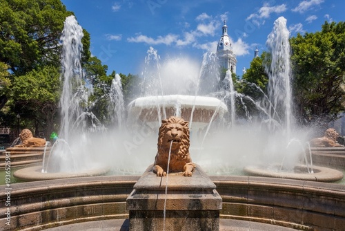 Daytime view of the Fountain of the Lions in Plaza Las Delicias, Ponce, Puerto Rico. Majestic lion sculptures spout water into the air 