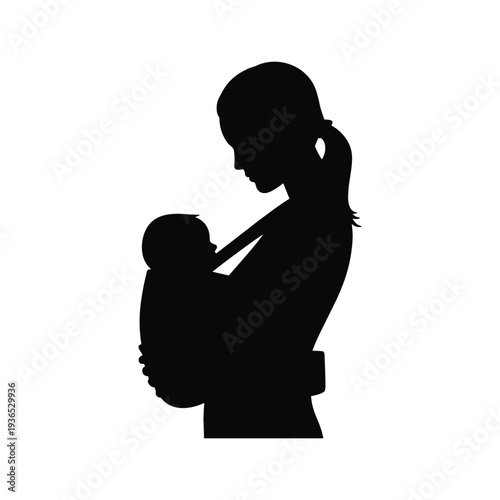 Loving mother holding baby close in tender silhouette