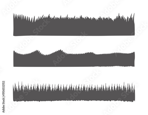 Three rows of dark gray grass silhouettes against white