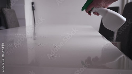 Cleaning at home table with pink cloth