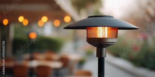 Outdoor patio heating lamp providing warmth and comfort on a restaurant terrace, creating a cozy evening ambiance for dining and socializing