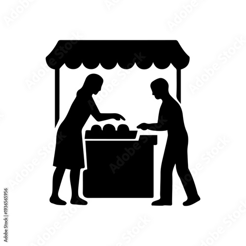 Street vendor selling produce to customer at market stall