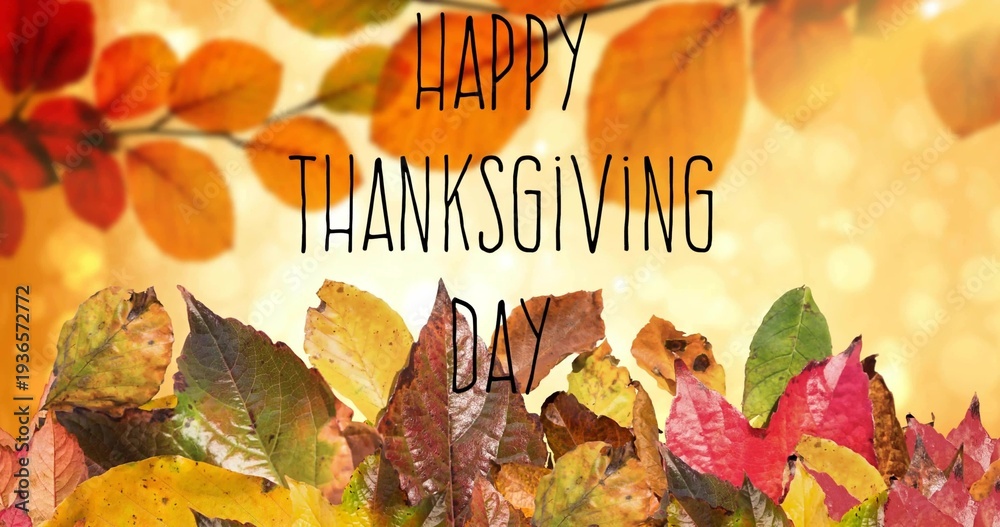 Fototapeta premium Showing center fall leaf pile forming band with warm bokeh soft branch HAPPY THANKSGIVING DAY text