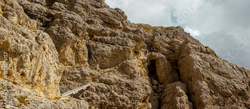 Bild auf Leinwand Dolomites via ferrata route carved limestone cliffs dramatic alpine climbing adv