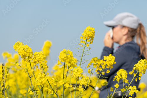 woman suffering from pollen allergy while  training outdoors