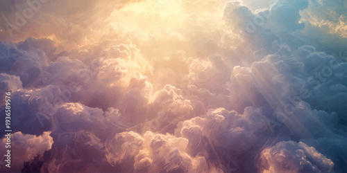 Beautiful sunrise light pierces through a blue nature cloudscape as the sun rises over white clouds in the summer sky atmosphere
