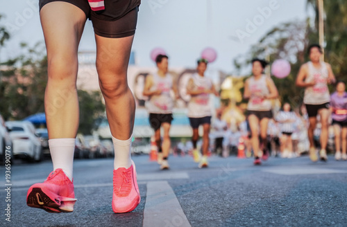 Athletic motivation: Running shoes close-up with blurred runners in background