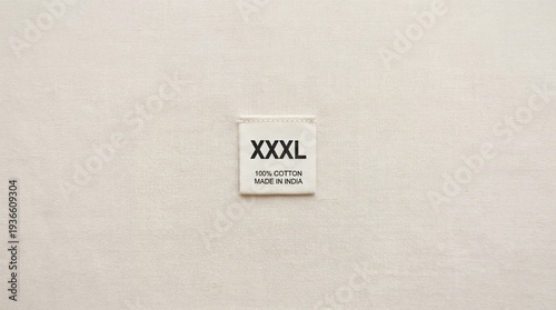 Xxxl size clothing label indicating percent cotton and country of origin