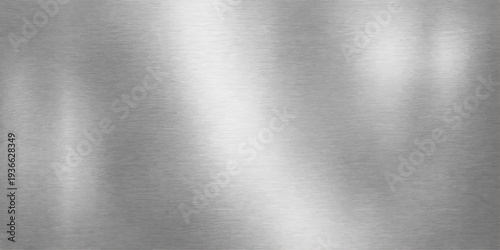 Abstract metallic texture featuring subtle gradations of light and shadow, presenting a minimalist design ideal for backgrounds or showcasing textures. 