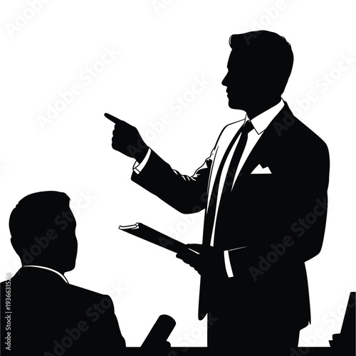A business professional emphatically points while addressing a seated colleague