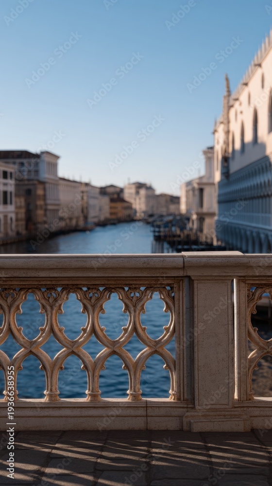 Fototapeta premium Ornate Bridge Framing Scenic View of Venice Canals and Architecture Under Blue Sky
