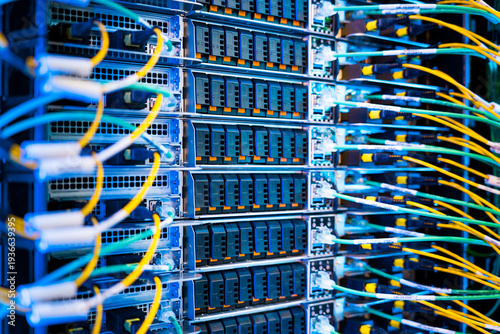 close up of server racks in a data center used for ai with cables and plugs. Concept of hardware and connectivity for AI computing center