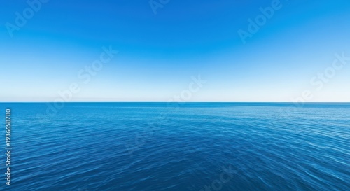 Expansive ultra-wide panoramic vista capturing the massive deep blue ocean stretching endlessly toward the seamless horizon and clear blue sky, deep, horizon, expansive