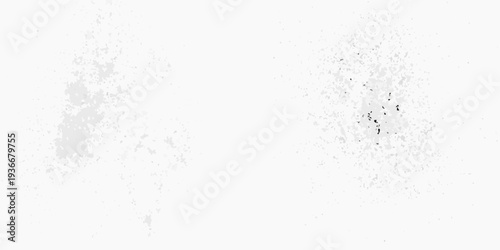 Abstract white background with scattered dark speckles and textured areas