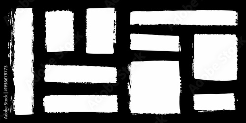 Abstract arrangement of white rectangular brushstrokes on a black background