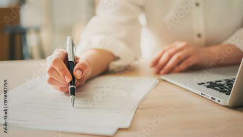Fotografija The businesswoman is reviewing the documents